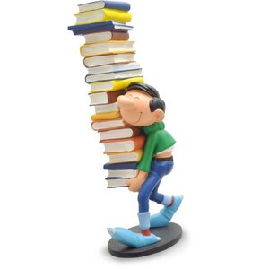 Figurine de Collection - COLLECTOYS - Gaston portant une pile de livres